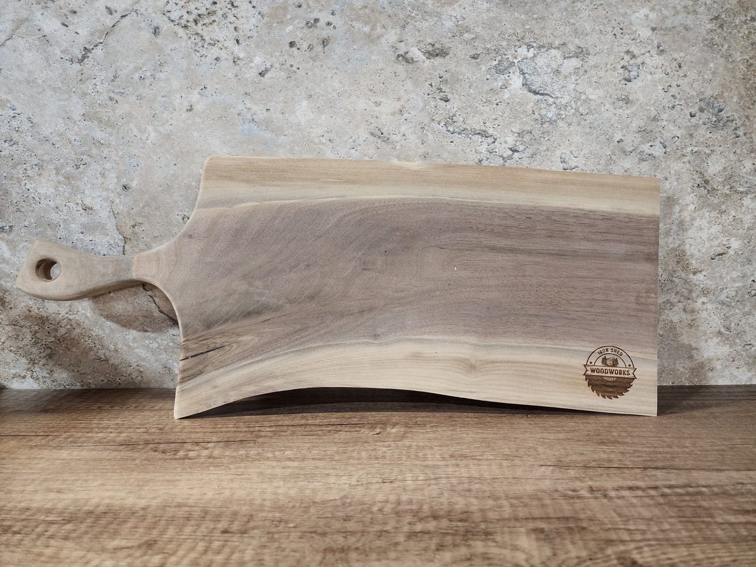 Raw live-edge serving slab with natural bark edge